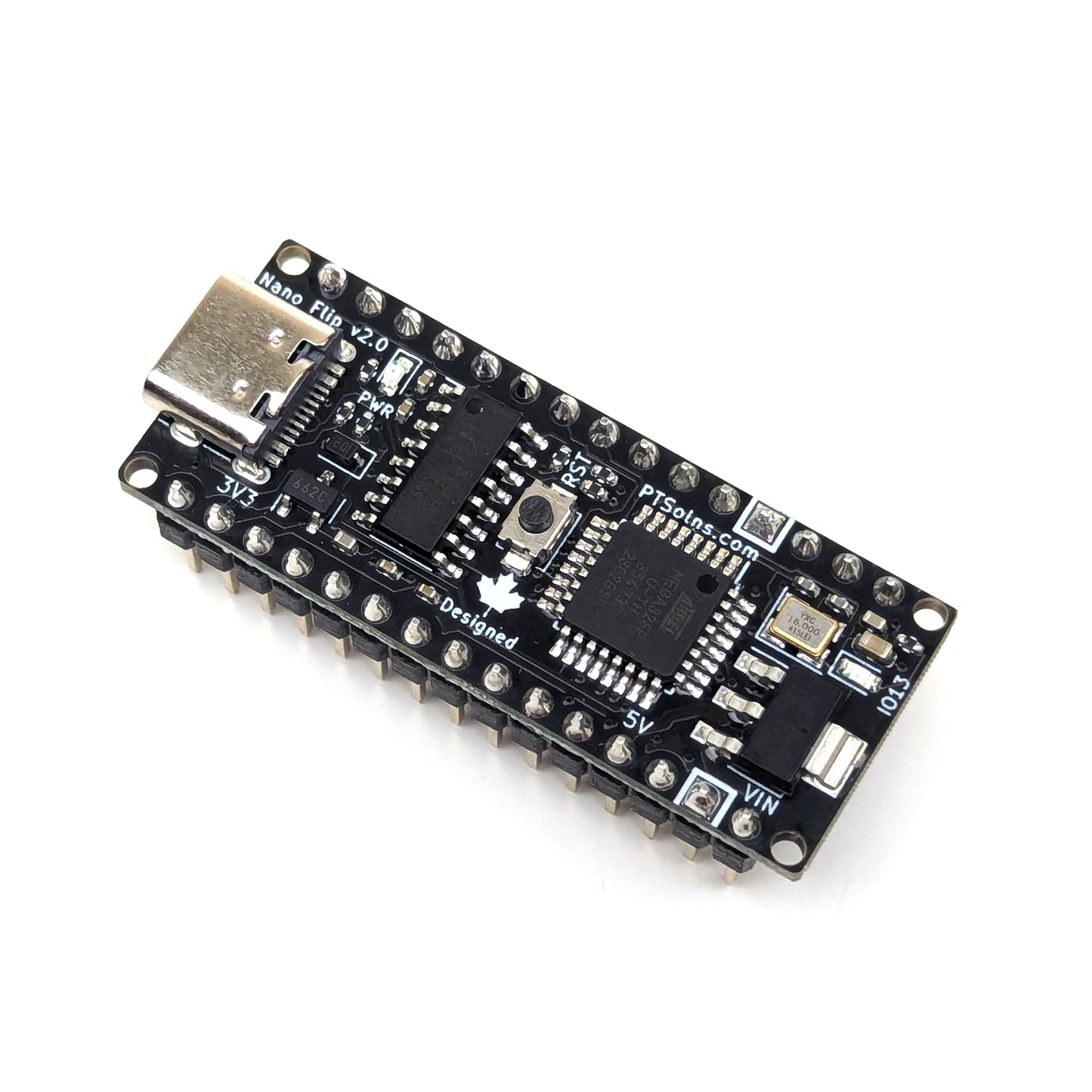 Top view of PTSolns Nano Flip microcontroller development board showing USB-C port, onboard reset and programmable IO13 LEDs, male headers, and compact design optimized for breadboard prototyping and embedded projects