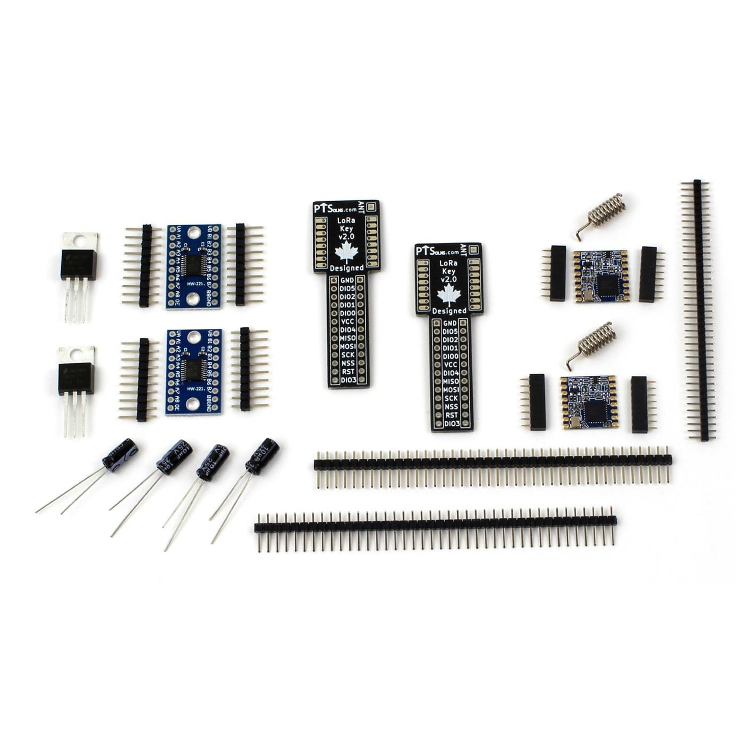 Product contents image showing all separate parts included in the PTSolns LoRa Key package: two LoRa SX1276 915MHz transceiver modules, two PTSolns LoRa Key breakout boards with 2.54mm pitch adapters, 8-channel bi-directional logic level shifters, LM1117 3.3V voltage regulators, smoothing capacitors, and assembly instructions—required assembly for full prototyping setup