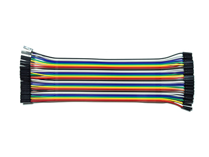 A bundle of 40 DuPont wires in various colors including black, white, grey, purple, blue, green, yellow, orange, and red, arranged neatly side by side.