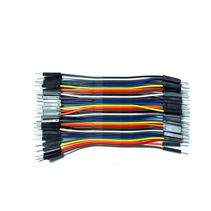 A bundle of 40 DuPont wires in various colors including black, white, grey, purple, blue, green, yellow, orange, and red, arranged neatly side by side.