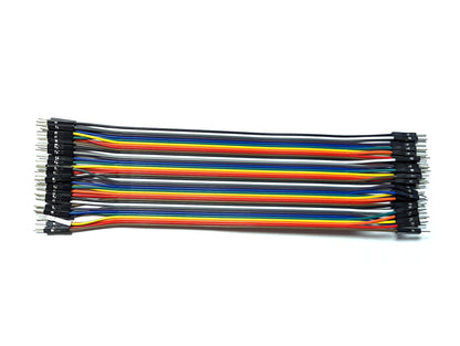 A bundle of 40 DuPont wires in various colors including black, white, grey, purple, blue, green, yellow, orange, and red, arranged neatly side by side.